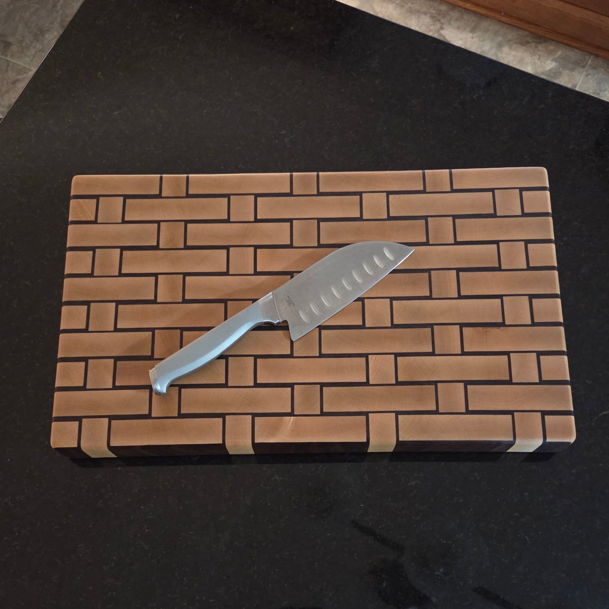 Wooden Cutting board with a woven pattern to look like it's made from wicker.
