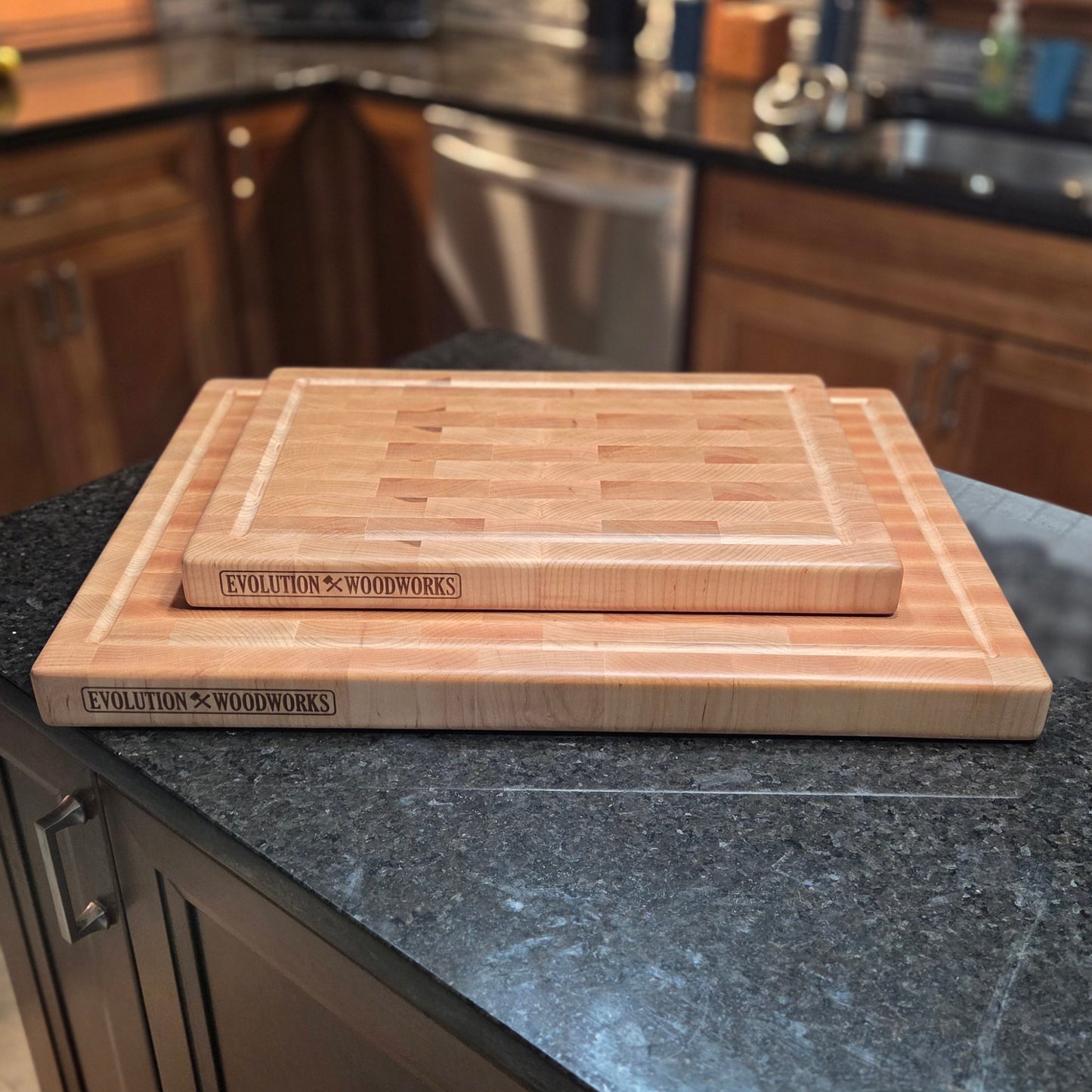Wooden cutting board on a kitchen counter with blurred background