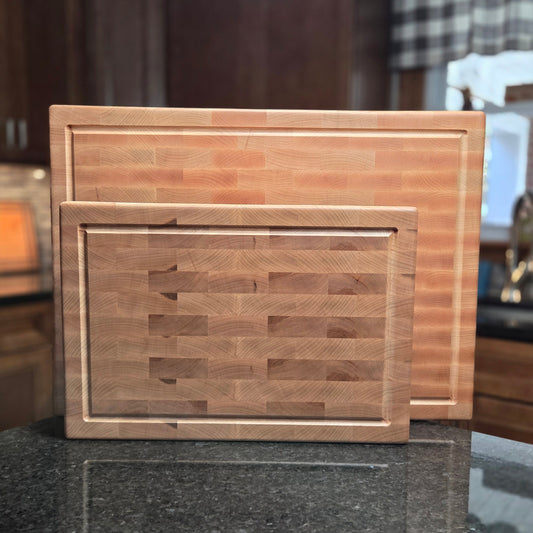 Wooden cutting board on a dark surface with a blurred background