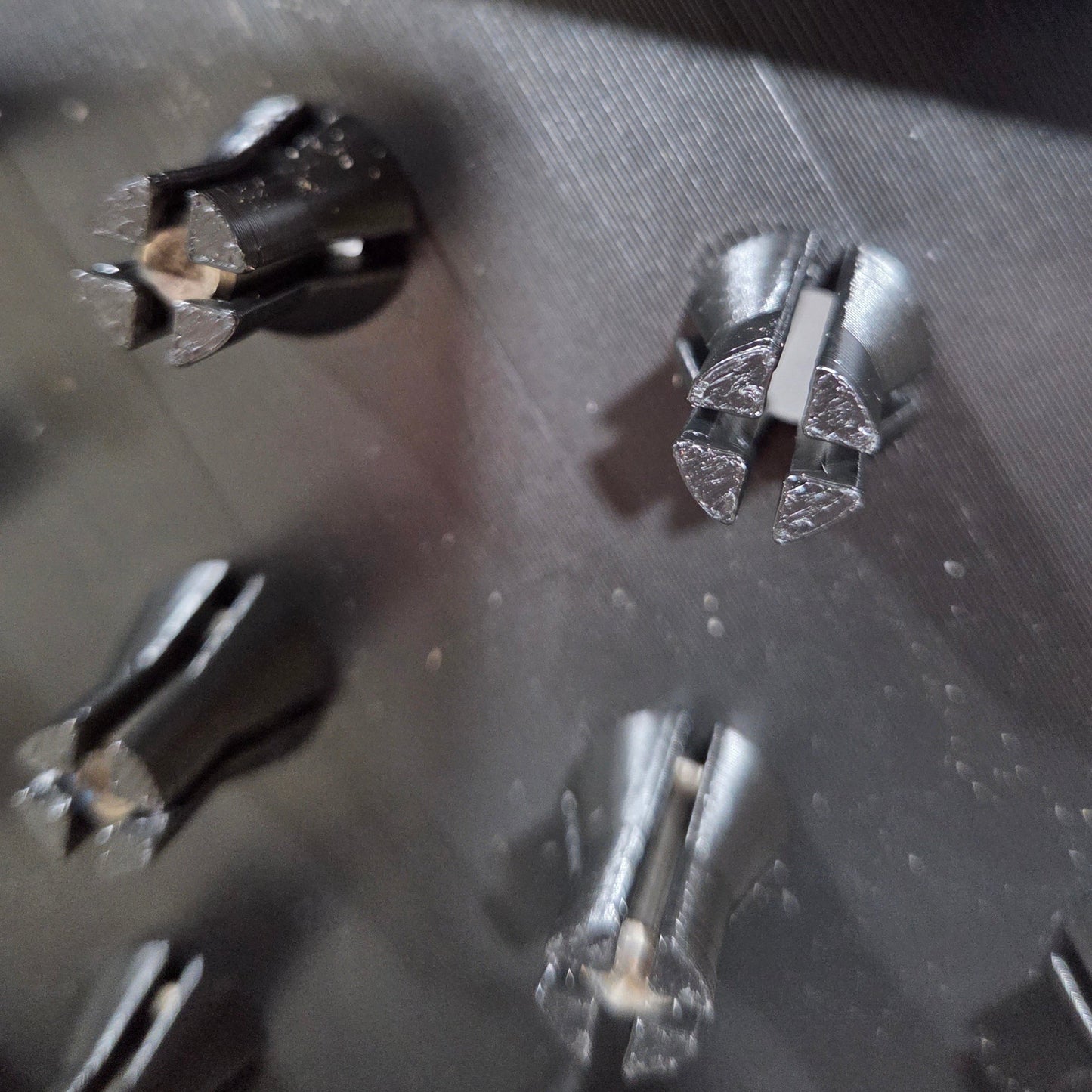 close up of gripping fingers on router bit storage tray