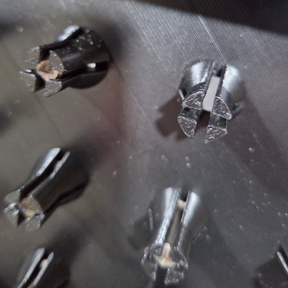 close up of gripping fingers on router bit storage tray